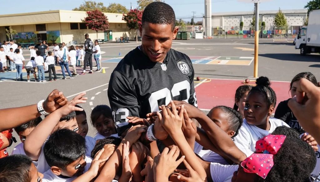 Photo of Darren Waller with Children