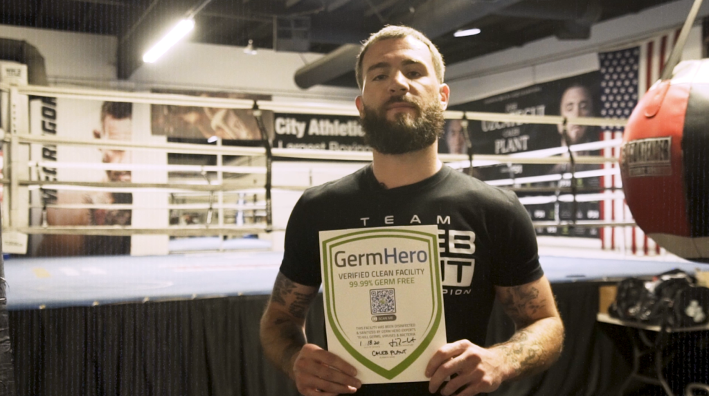 Caleb Plant Holds Up Germ Hero Sign